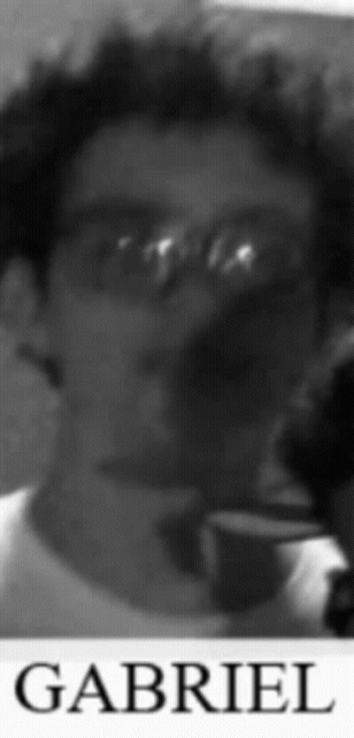 A Black And White Photo Of Gabriel With Glasses On GIF