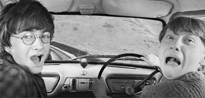 A Black And White Photo Of Harry Potter And Ron Weasley Driving A Car . GIF