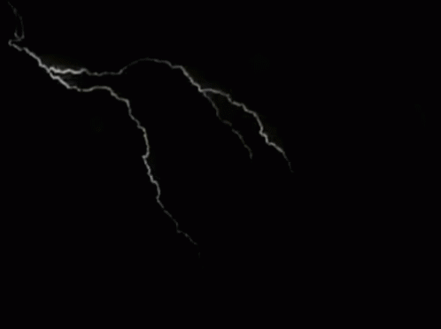A Black And White Photo Of Lightning In The Sky GIF