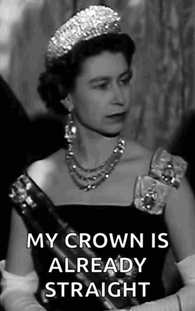 A Black And White Photo Of Queen Elizabeth Ii Wearing A Tiara And A Necklace . GIF