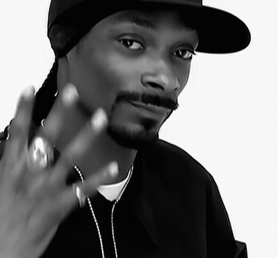 A Black And White Photo Of Snoop Dogg Wearing A Black Hat GIF