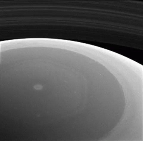 A Black And White Photo Of The Inside Of A Planet GIF
