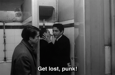 A Black And White Photo Of Three Men Standing In A Bathroom With The Caption Get Lost Punk GIF