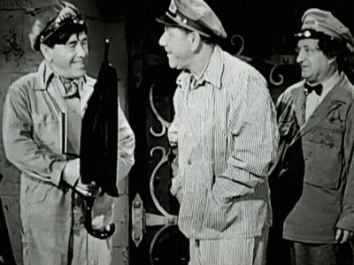A Black And White Photo Of Three Men With One Wearing A Hat That Says " Army " GIF