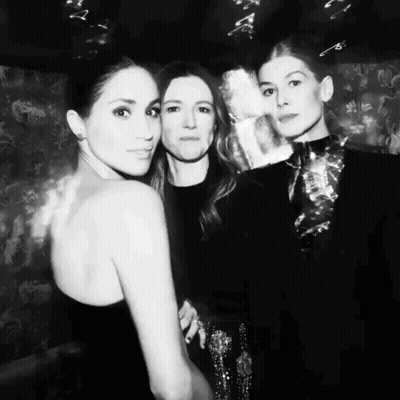 A Black And White Photo Of Three Women Posing For The Camera GIF