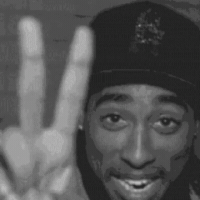 A Black And White Photo Of Tupac Shakur Making A Peace Sign . GIF
