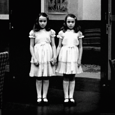 A Black And White Photo Of Two Little Girls Standing Next To Each Other With A Caption That Says Accentuated Objects GIF