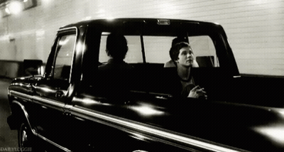A Black And White Photo Of Two Men In A Truck Taken By Dailydoogie GIF