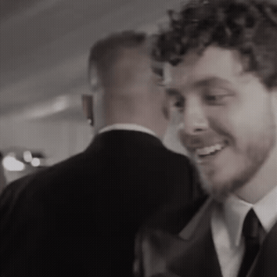 A Black And White Photo Of Two Men In Suits And Ties GIF