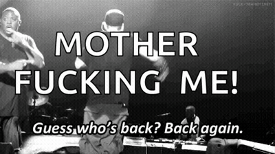 A Black And White Photo Of Two Men On Stage With The Words Mother Fucking Me Guess Who 'S Back Back Again GIF
