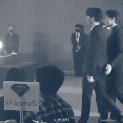 A Black And White Photo Of Two Men Standing Next To Each Other With The Words Winrises On The Bottom GIF