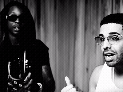 A Black And White Photo Of Two Men Wearing Sunglasses GIF