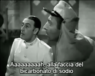 A Black And White Photo Of Two Men With A Caption That Says Aaa GIF