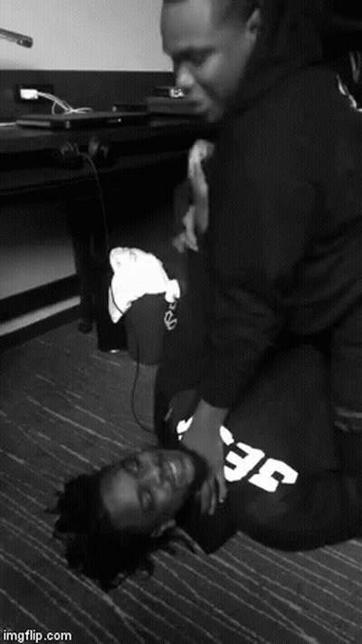 A Black And White Photo Of Two Men With One Wearing A Sweatshirt That Says Efc GIF