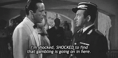 A Black And White Photo Of Two Men With The Caption I 'M Shocked Shocked To Find That Gambling Is Going On GIF