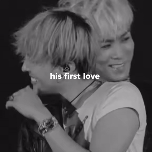 A Black And White Photo Of Two Men With The Words His First Love Written On The Bottom GIF