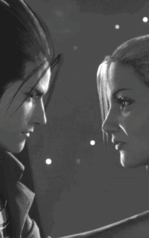 A Black And White Photo Of Two People Kissing GIF