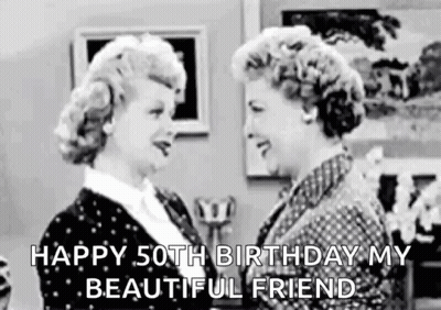 A Black And White Photo Of Two Women Standing Next To Each Other And Talking . GIF