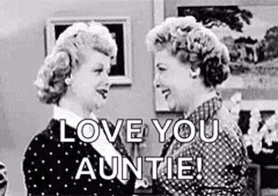 A Black And White Photo Of Two Women Standing Next To Each Other And Talking . GIF