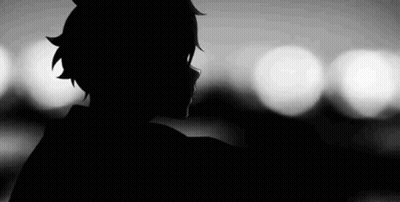 A Black And White Silhouette Of A Person Standing In Front Of A Blurry Background . GIF