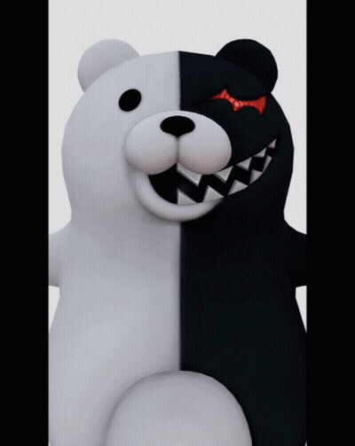 A Black And White Teddy Bear With Sharp Teeth GIF