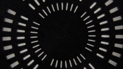 A Black Background With A Circular Pattern Of White Dots GIF