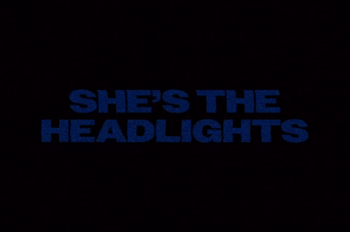 A Black Background With The Words She 'S The Headlights In Blue GIF