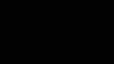 A Black Bmw Car Is Driving Around A Pile Of Tires GIF