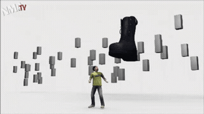 A Black Boot Is Surrounded By Blocks And The Words Nmjtv Are On The Bottom Right GIF