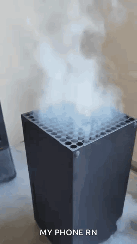 A Black Box With Smoke Coming Out Of It And The Words `` My Phone Rn '' Written On The Bottom . GIF