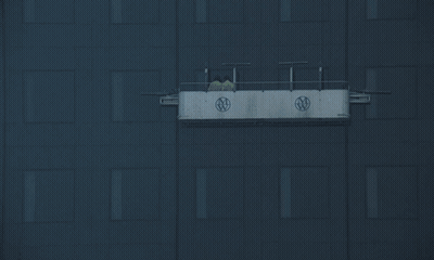 A Black Building With A White Sign On The Side That Says Ntv GIF