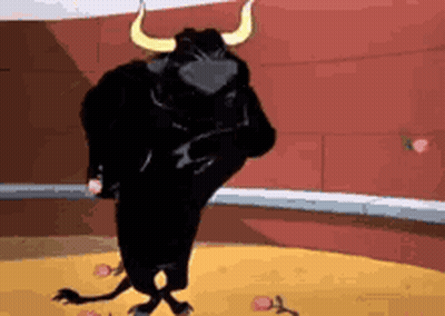 A Black Bull With Horns Is Standing In A Bullring . GIF