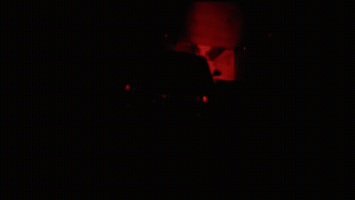 A Black Car Is Driving Down A Highway GIF
