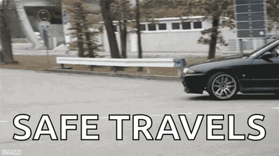 A Black Car Is Driving Down A Street With The Words Safe Travels Written On The Bottom GIF