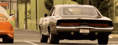 A Black Car With A California License Plate Is Parked Next To Another Car GIF