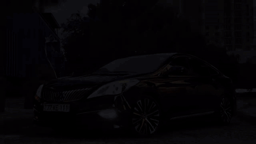 A Black Car With A License Plate That Reads 77 Ke 111 GIF