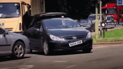 A Black Car With A License Plate That Says Mad4 Znw GIF