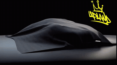 A Black Car With A Yellow Crown And The Word Upland On The Bottom GIF