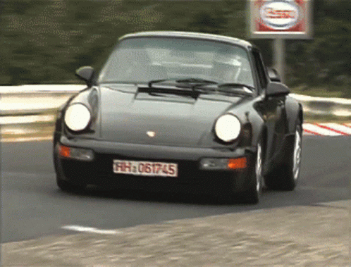 A Black Car With The License Plate Fh 061745 GIF