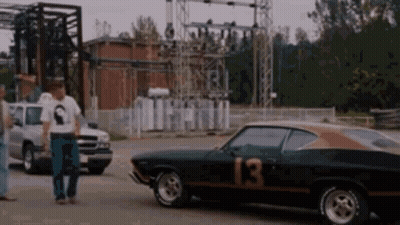 A Black Car With The Number 13 On It GIF