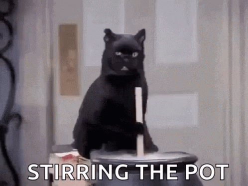 A Black Cat Is Sitting On Top Of A Cauldron With The Words Stirring The Pot . GIF