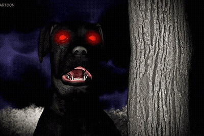 A Black Dog With Red Eyes Stands Next To A Tree GIF