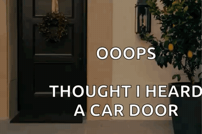 A Black Door With A Wreath On It And The Words Oops Thought I Heard A Car Door Below It GIF