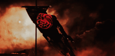 A Black Flag With A Red Dragon On It Is Flying In The Wind GIF