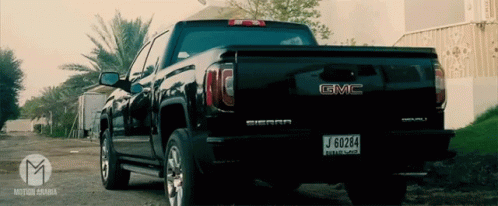 A Black Gmc Truck With A License Plate That Says J 60284 GIF