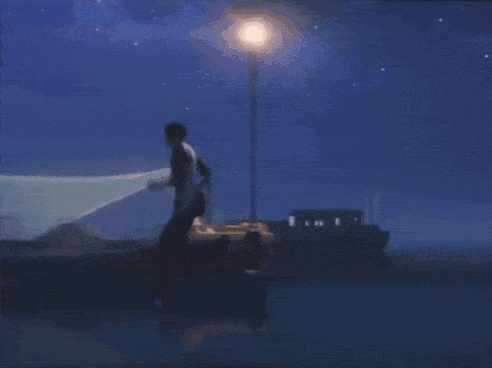 A Black Horse Running On A Beach With A Sunset In The Background GIF