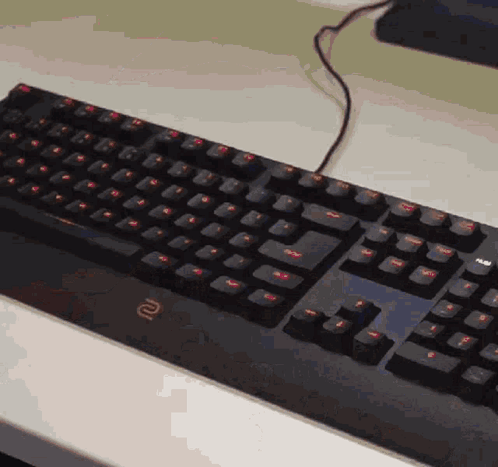 A Black Keyboard With The Letter R On The Bottom Right GIF