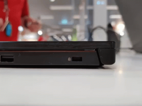 A Black Laptop With A Padlock On The Side Of It GIF