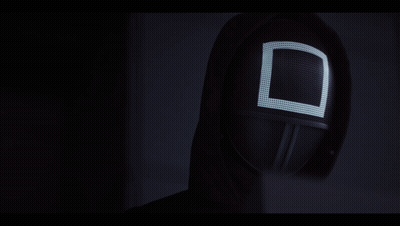 A Black Mask With A White Square On It GIF