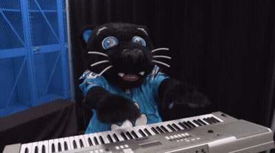 A Black Panther Mascot Playing A Keyboard With A Blue Shirt On GIF